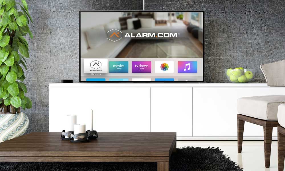 Alarm.Com TV on white stand